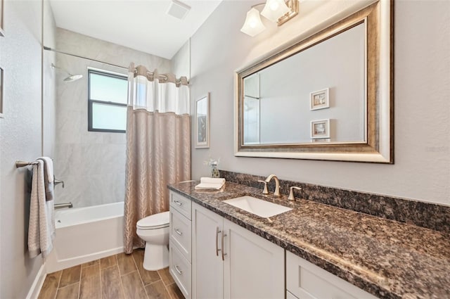 full bathroom featuring vanity, toilet, and shower / bath combo