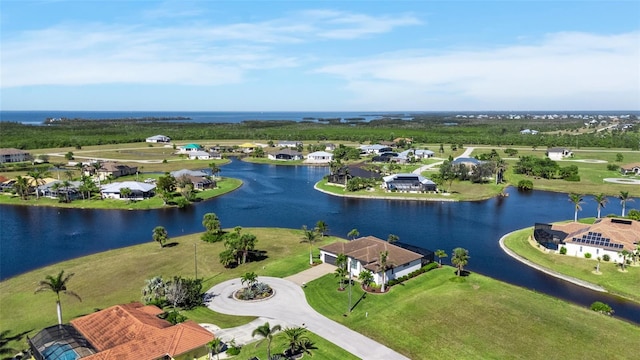 drone / aerial view with a water view