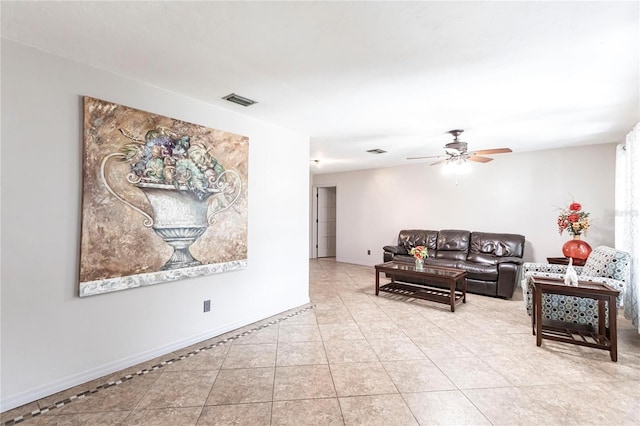 tiled living room featuring ceiling fan