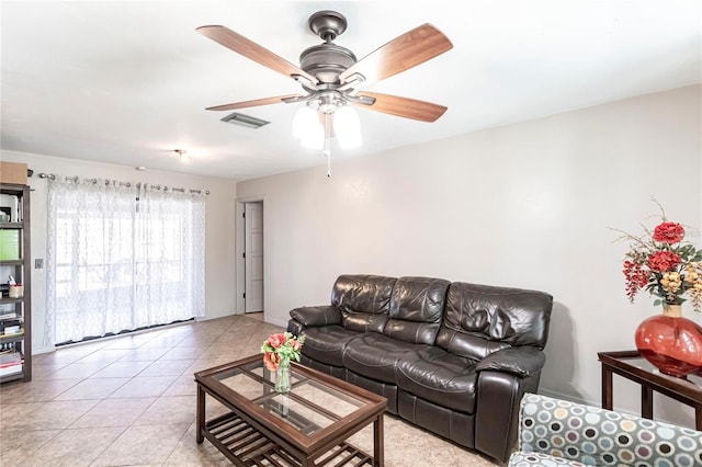 living room with light tile patterned floors and ceiling fan