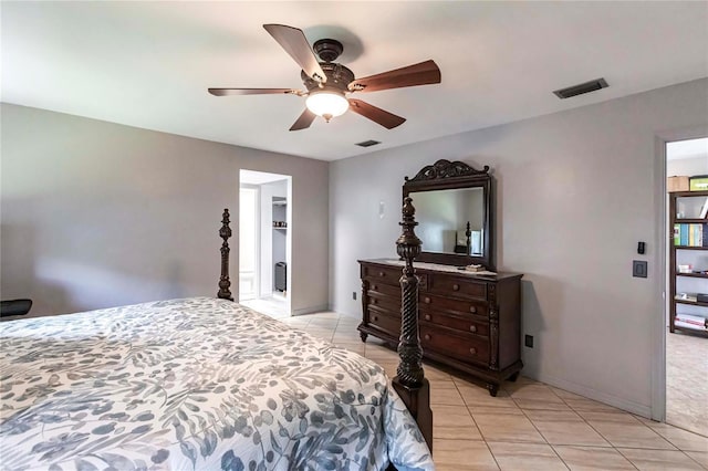 bedroom featuring light tile patterned flooring and ceiling fan