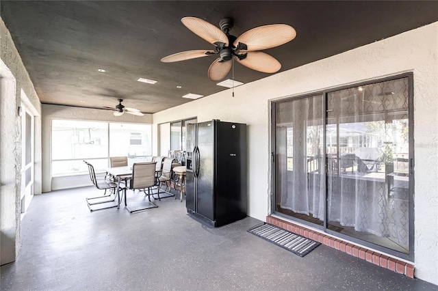 sunroom / solarium with ceiling fan