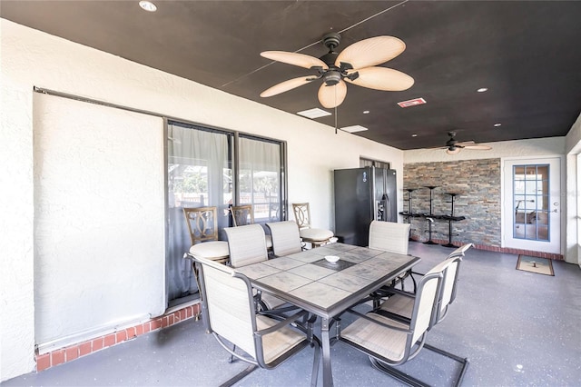 view of patio / terrace featuring ceiling fan