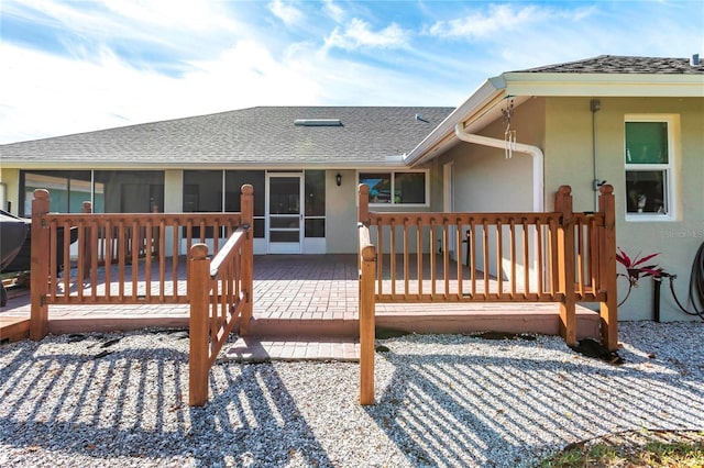 deck with a sunroom