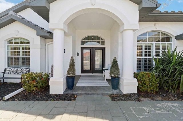 property entrance featuring french doors