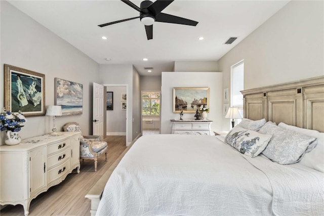 bedroom featuring light hardwood / wood-style floors and ceiling fan