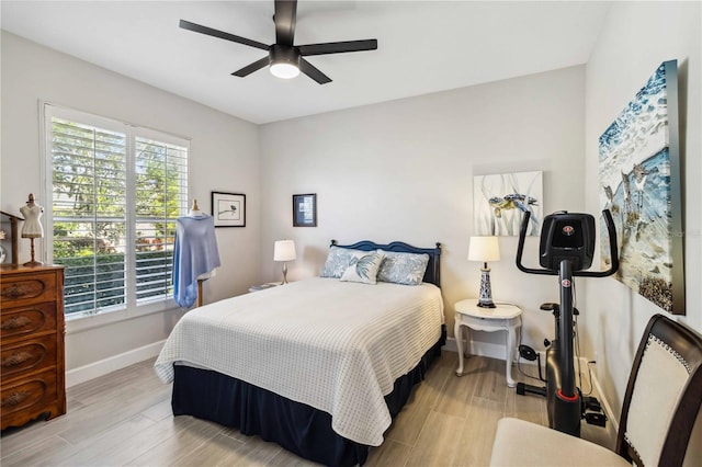 bedroom with ceiling fan and light wood-type flooring