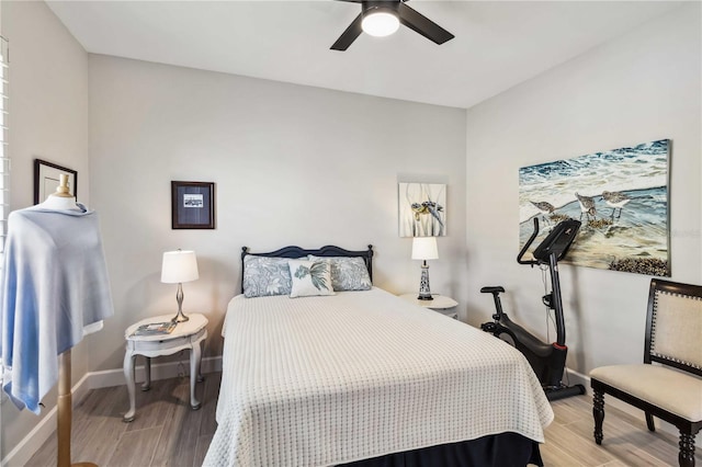 bedroom featuring ceiling fan and light hardwood / wood-style flooring