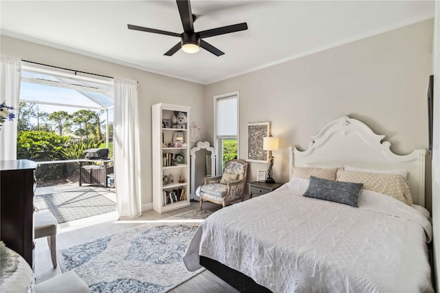 bedroom with ornamental molding, access to exterior, ceiling fan, and light hardwood / wood-style flooring