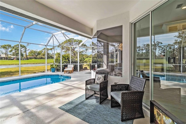 view of pool with a lanai and a patio area