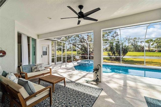 view of pool featuring a lanai, ceiling fan, outdoor lounge area, a patio area, and an in ground hot tub