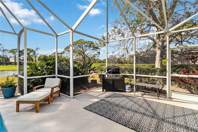 unfurnished sunroom with a water view