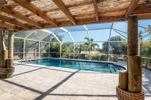 view of pool with a lanai and a patio area