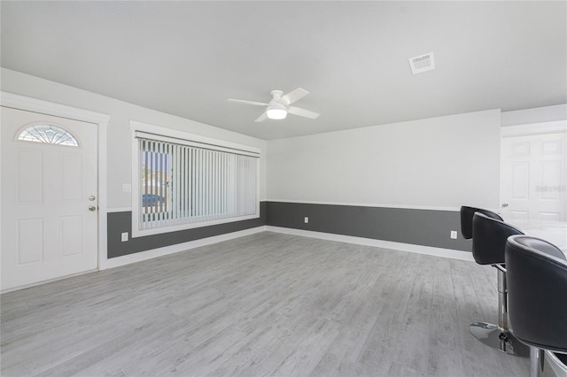 unfurnished office featuring ceiling fan and light hardwood / wood-style flooring