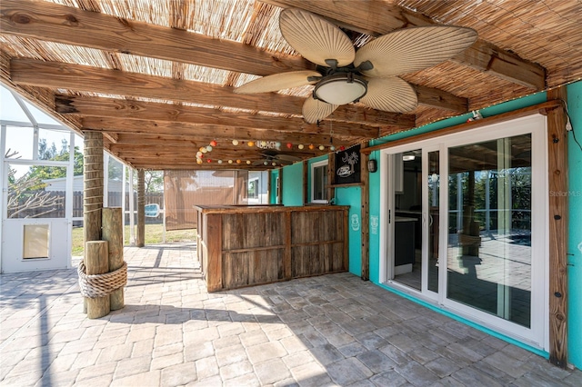 view of patio / terrace with a lanai and ceiling fan