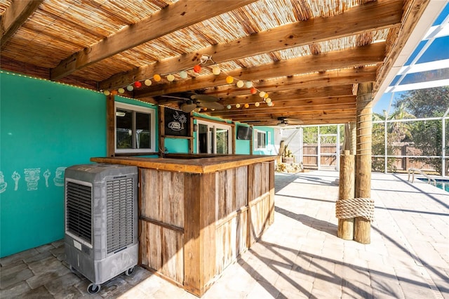 bar featuring heating unit, wood ceiling, and beam ceiling