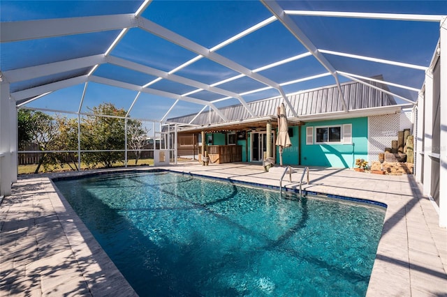 view of pool featuring a lanai and a patio area