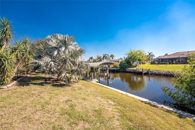 view of dock featuring a water view and a lawn