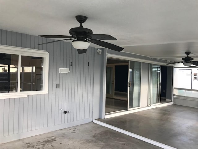 exterior space featuring ceiling fan