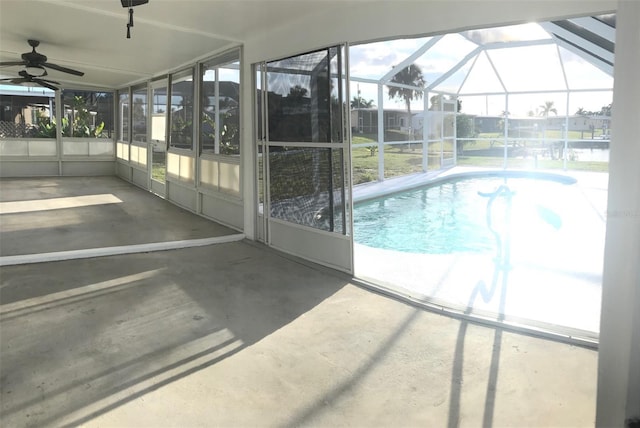 view of swimming pool with a lanai, a patio, and ceiling fan