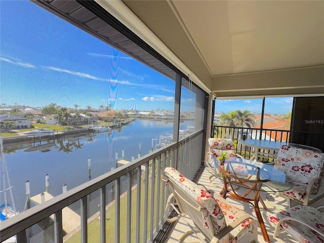 balcony featuring a water view