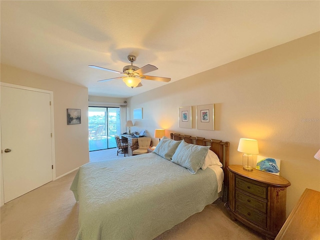 carpeted bedroom featuring ceiling fan and access to outside