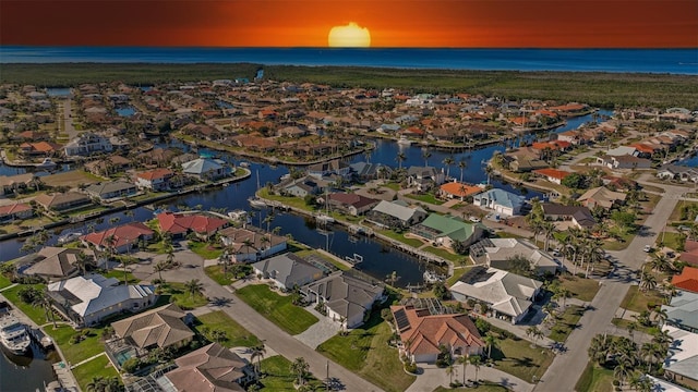 aerial view with a residential view and a water view