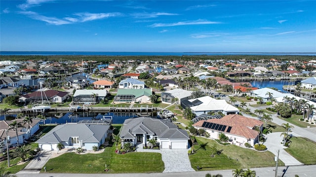 aerial view featuring a water view and a residential view