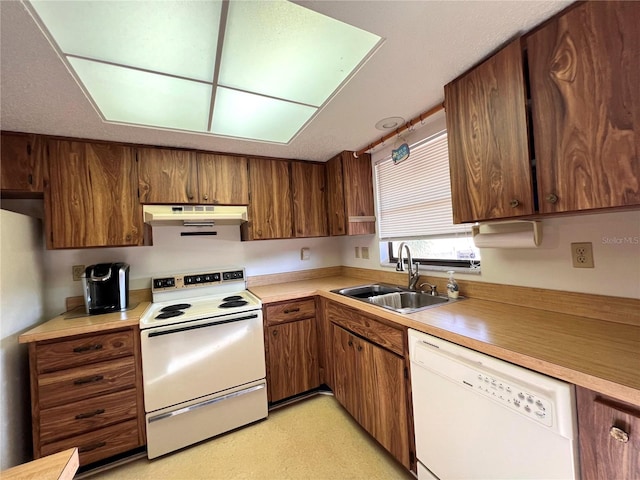 kitchen with sink and white appliances