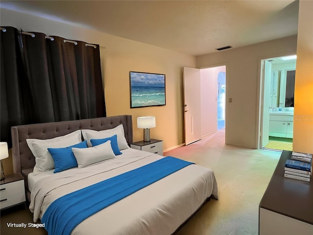 bedroom featuring ensuite bathroom