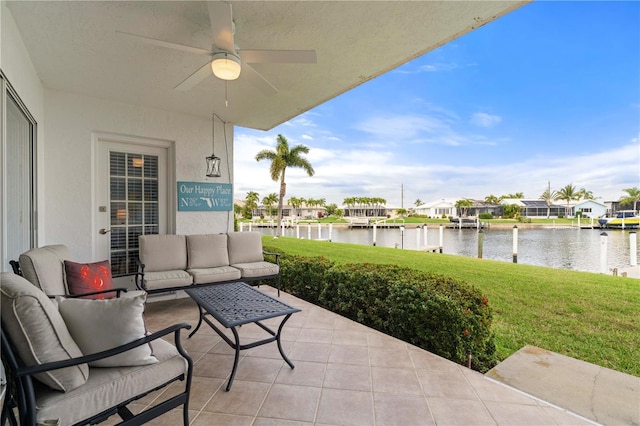 view of patio / terrace featuring a water view, outdoor lounge area, and ceiling fan