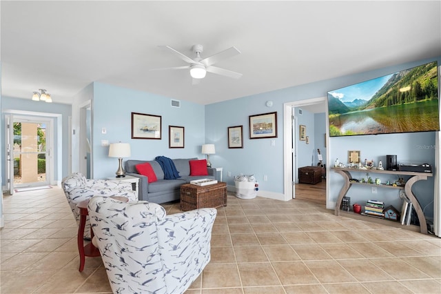 tiled living room with ceiling fan