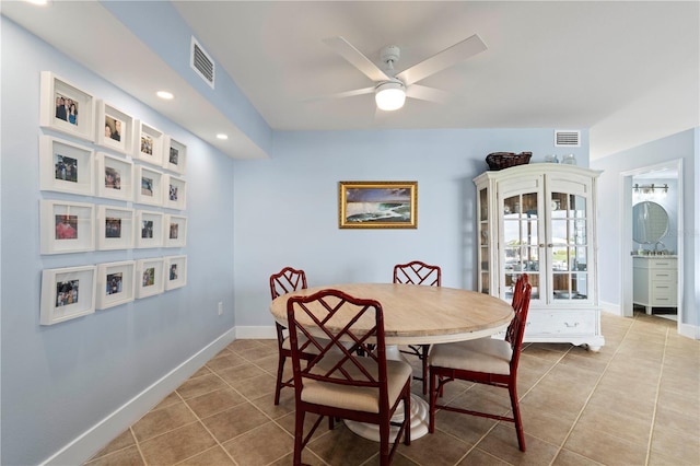 tiled dining area featuring french doors and ceiling fan