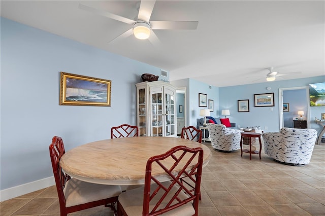 dining room featuring ceiling fan and light tile patterned floors