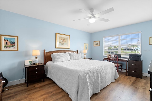 bedroom with hardwood / wood-style flooring and ceiling fan