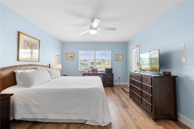 bedroom featuring light hardwood / wood-style flooring and ceiling fan