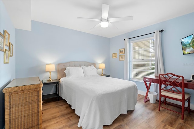 bedroom featuring hardwood / wood-style flooring and ceiling fan