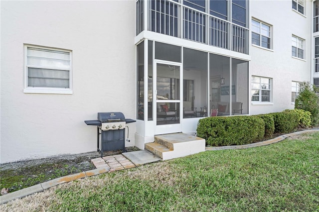 property entrance with a yard