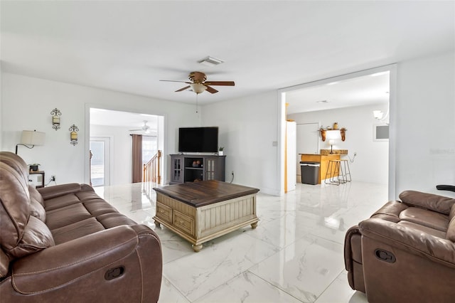 living room featuring ceiling fan