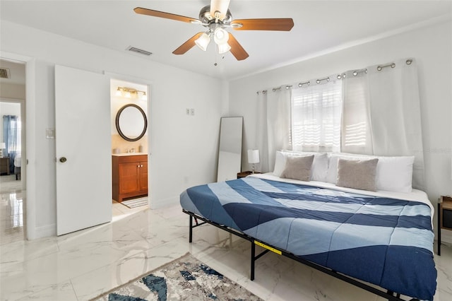 bedroom with ceiling fan and ensuite bath