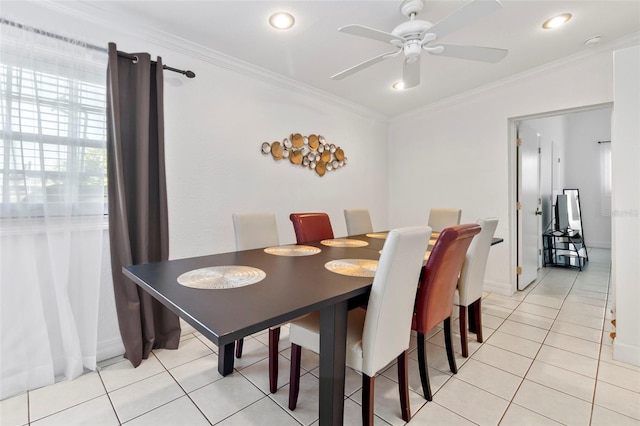 dining space featuring crown molding, ceiling fan, and light tile patterned floors