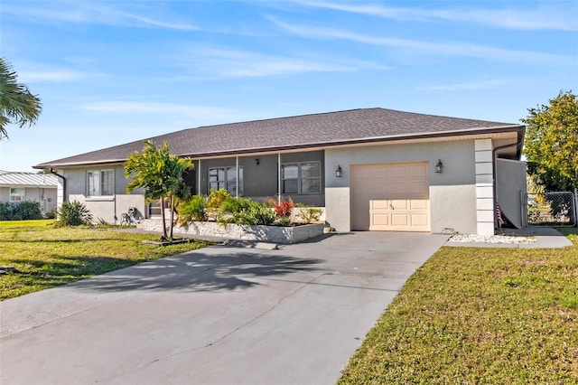 ranch-style home with a garage and a front lawn