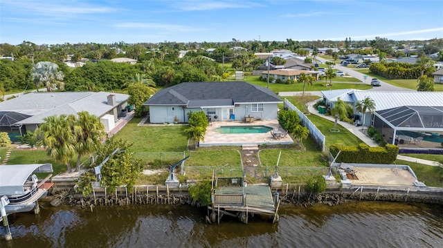 birds eye view of property with a water view