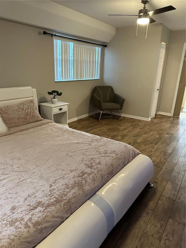 bedroom with dark wood-type flooring and ceiling fan