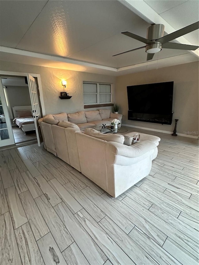 unfurnished living room featuring ceiling fan