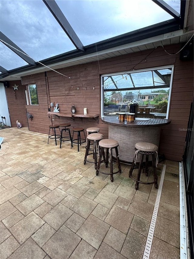 view of patio / terrace featuring an outdoor bar