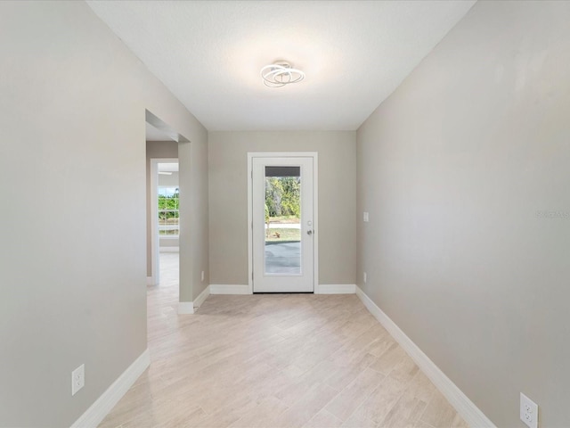 doorway to outside featuring light hardwood / wood-style flooring