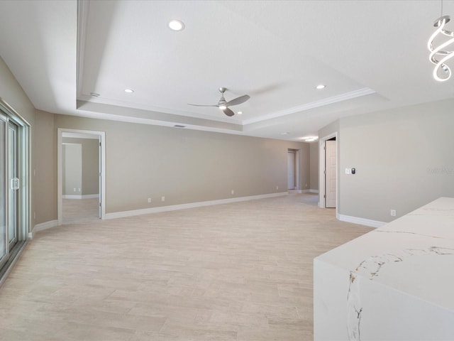 bedroom featuring ornamental molding, a raised ceiling, ceiling fan, and light wood-type flooring