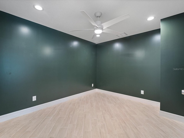 unfurnished room with ceiling fan and light hardwood / wood-style flooring