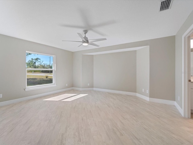 unfurnished room featuring ceiling fan and light wood-type flooring